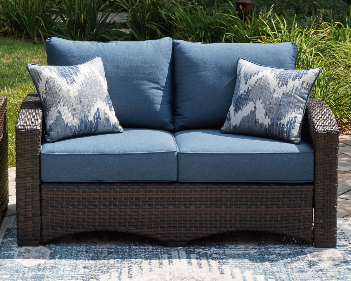 Windglow Outdoor Loveseat with Cushion - Half Price Furniture