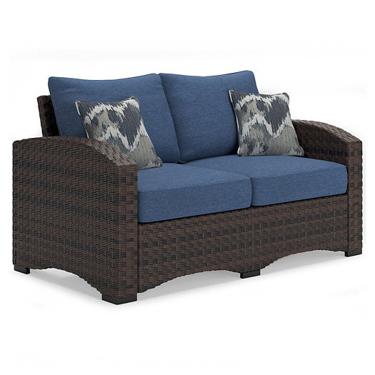 Windglow Outdoor Loveseat with Cushion Half Price Furniture